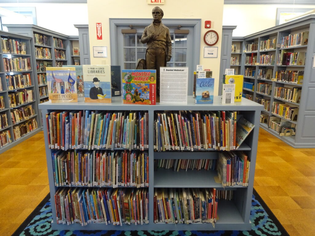 Pictures of biographies shelves on 2nd floor of Clark Memorial Library.